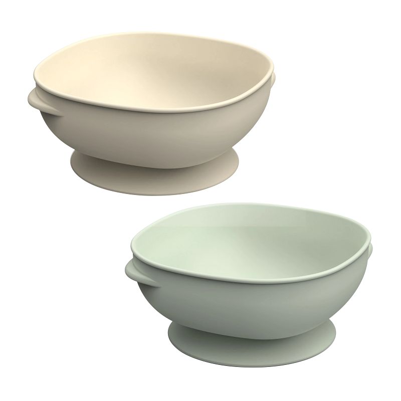 Deux bols à ventouse Dr. Brown’s en coloris écru et menthe, avec bords hauts et arrondis pour faciliter les repas de bébé.